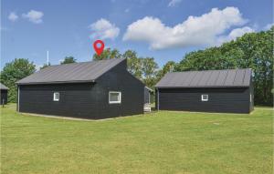 two houses with a red marker on top of them at Holiday Home Halvejen Hytte Spjald Xii in Spjald +17 photos