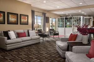 a large living room with couches and chairs at Ramada by Wyndham Pigeon Forge North in Pigeon Forge