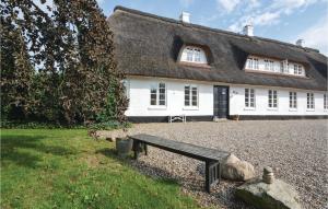 a house with a bench in front of it at Stunning Home In Haderslev With Kitchen in Haderslev