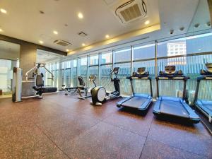 a gym with treadmills and cardio equipment in a building at Piazza Hotel Nara in Nara