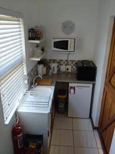 A kitchen or kitchenette at Rooftops