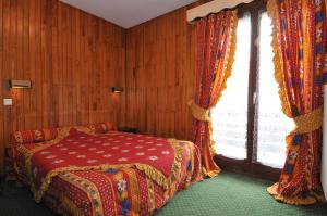 Postel nebo postele na pokoji v ubytování Hôtel Le Mont Jorat