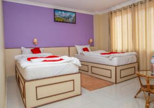 Postel nebo postele na pokoji v ubytování Hotel Tranquil
