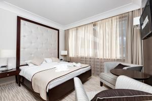Postel nebo postele na pokoji v ubytování GARNI HOTEL AMI + 30 fotografií