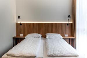 Ліжко або ліжка в номері Muontis