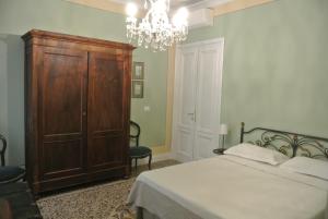 Postel nebo postele na pokoji v ubytování Palazzo Zecchino B&B