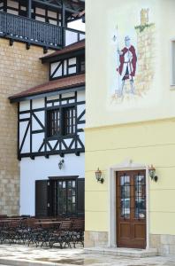 a building with a painting on the side of it at Hotel Castel Royal in Timişoara