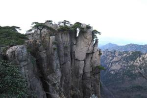 a mountain with trees on top of it at Old Street Xi'an Inn (Free Pick up Service) in Huangshan