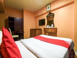 Krevet ili kreveti u jedinici u objektu OYO 270 Dream Land Hotel