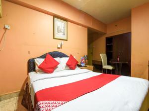 Krevet ili kreveti u jedinici u objektu OYO 270 Dream Land Hotel