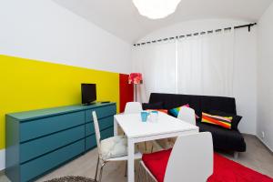 a living room with a table and a couch at Budget Apartment in Prague