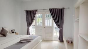 Postel nebo postele na pokoji v ubytování Casa Blanca Gili Air