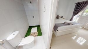 Postel nebo postele na pokoji v ubytování Casa Blanca Gili Air