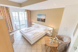 Postel nebo postele na pokoji v ubytování Hotel Königslinie