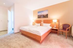 Postel nebo postele na pokoji v ubytování Hotel Königslinie