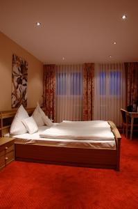 Ένα ή περισσότερα κρεβάτια σε δωμάτιο στο Zur alten Brücke