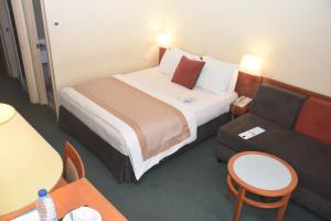 Un ou plusieurs lits dans un hébergement de l'établissement Hôtel Sawa