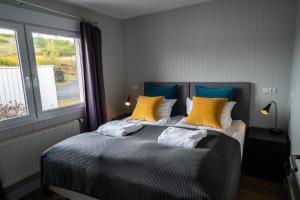 Ліжко або ліжка в номері Frost and Fire Hotel