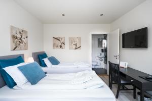 Ліжко або ліжка в номері Frost and Fire Hotel
