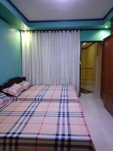 Postel nebo postele na pokoji v ubytování Mary Chiang Baguio Transient House