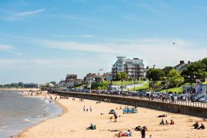a group of people on a beach near the water at The Bays Clee Rd in Cleethorpes