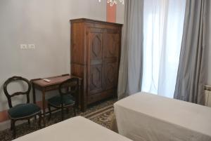 Postel nebo postele na pokoji v ubytování Palazzo Zecchino B&B