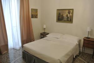 Postel nebo postele na pokoji v ubytování Palazzo Zecchino B&B