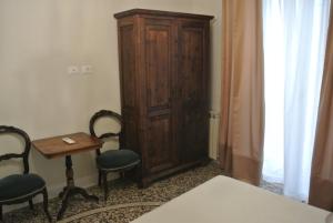 Postel nebo postele na pokoji v ubytování Palazzo Zecchino B&B