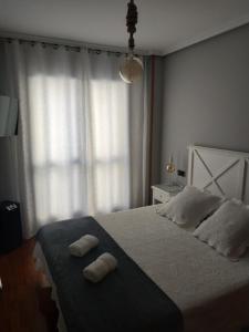 A bed or beds in a room at Apartamento Edificio Plaza Gran Vía