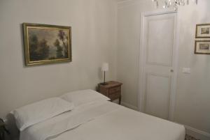 Postel nebo postele na pokoji v ubytování Palazzo Zecchino B&B