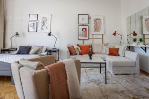 a living room with two couches and a couch at Cozy Old Town Apartments in Kraków