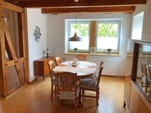a dining room with a table and chairs at Schöne Ferienwohnung 120qm 4+2 Pers. in Fehmarn