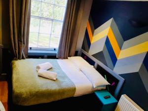 Postel nebo postele na pokoji v ubytování KX Rooms Kings Cross
