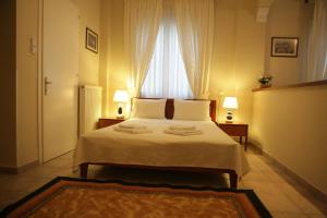 Ένα ή περισσότερα κρεβάτια σε δωμάτιο στο Katerina studios rooms-Biker friendly hotel