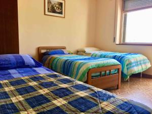 Un pat sau paturi într-o cameră la La Terrazza di Filomena - Picinisco, Parco Lazio & Abruzzo