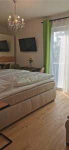Katil atau katil-katil dalam bilik di Enjoyit Velden West