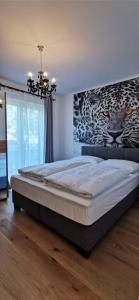 Katil atau katil-katil dalam bilik di Enjoyit Velden West