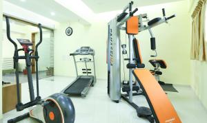 a gym with two tread machines and a treadmill at Treebo Trend The Galaxy Chandapura in Bangalore