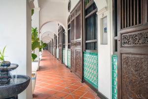 a corridor of a building with a hallway at Areca Hotel Penang in George Town