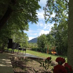a park with a playground and a swing set at Green Side in Kotor
