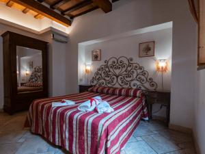 Posteľ alebo postele v izbe v ubytovaní B&B Siena In Centro - Diffuso