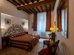 Posteľ alebo postele v izbe v ubytovaní B&B Siena In Centro - Diffuso
