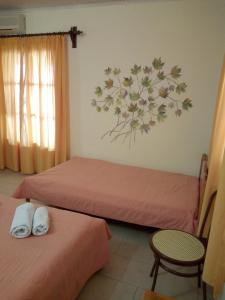 A bed or beds in a room at Pansion Matoula