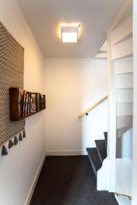 a staircase in a house with a stair case at Bamboa Beachhouse in Zandvoort