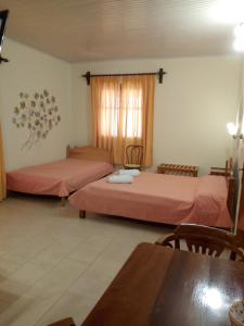A bed or beds in a room at Pansion Matoula