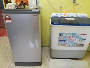 two trash cans sitting next to each other at Jitra homestay in Jitra