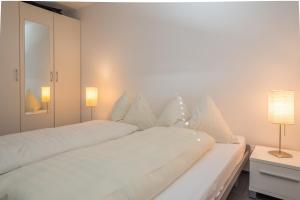 Ένα ή περισσότερα κρεβάτια σε δωμάτιο στο LAAX Homes Prada Biala