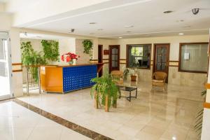 a lobby of a building with plants on the walls at APARTAMENT SARDINA NEAR THE BEACH WITH POOL AND WIFI e in Gáldar +31 photos