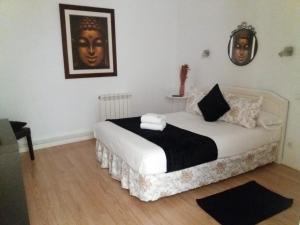 A bed or beds in a room at Casa de Huéspedes Prada