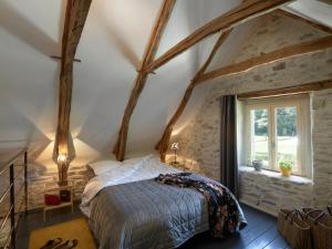 En eller flere senge i et værelse på Moulin des Borderies